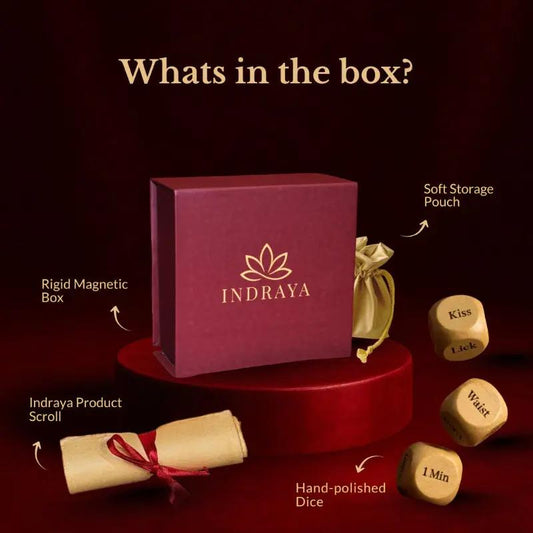Indraya product set with box, dice, and other items on a dark background