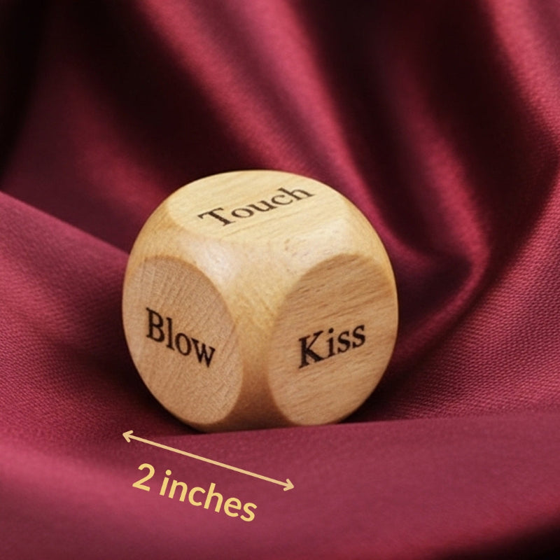 Wooden die with 'Touch', 'Blow', and 'Kiss' text on a red fabric background

