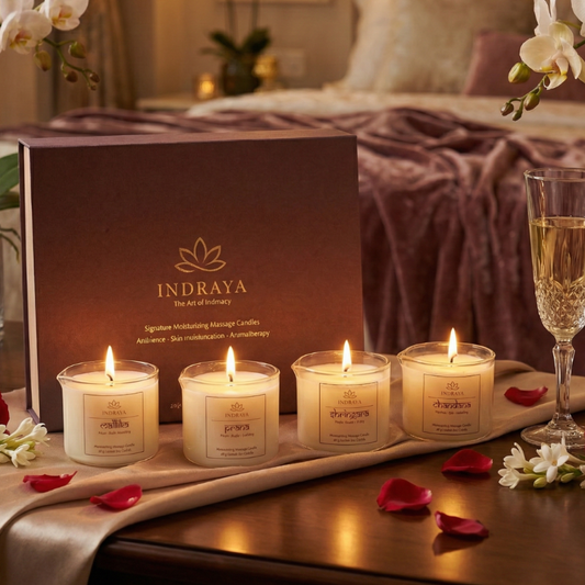 Indraya candles on a table with a box and wine glass in a cozy setting